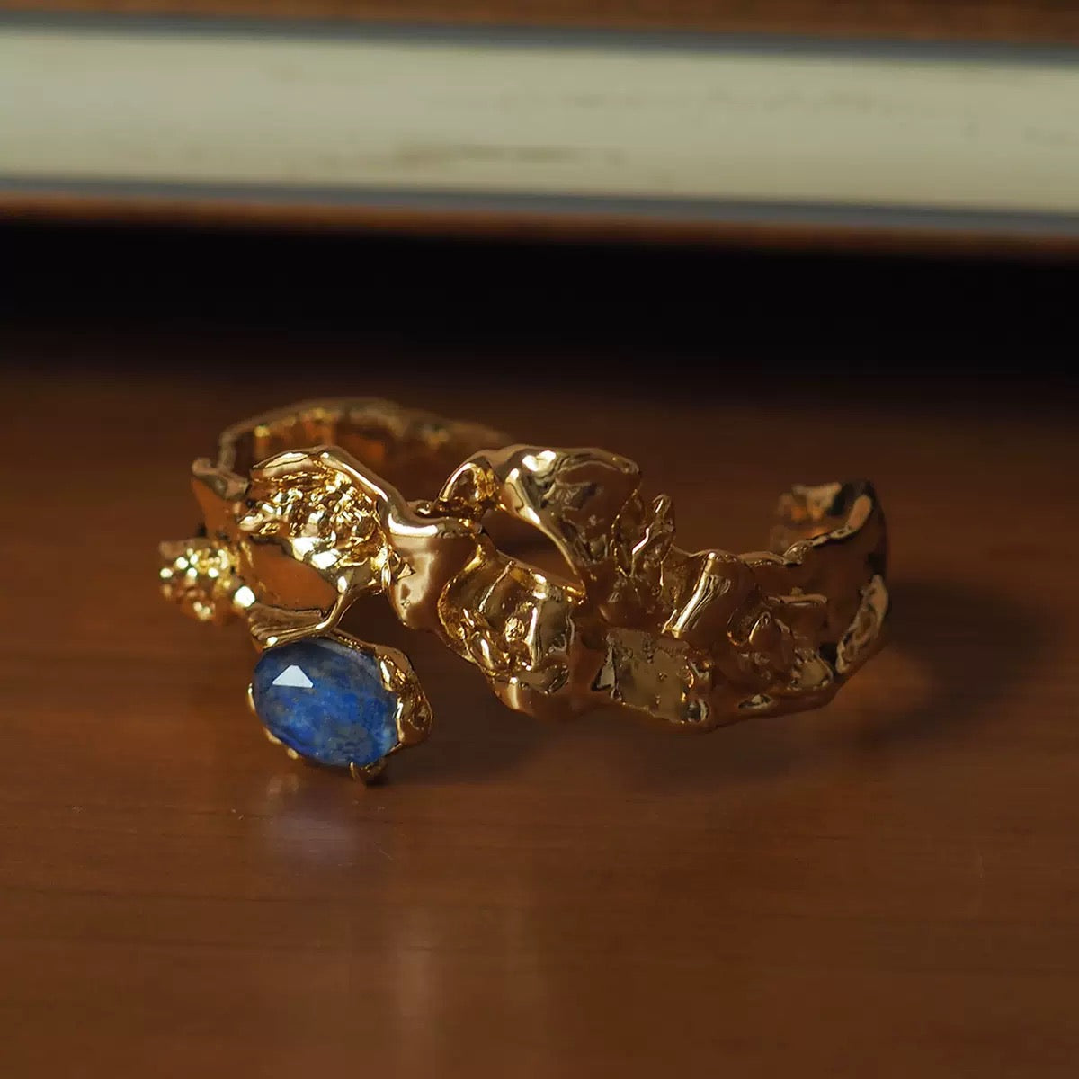 Modern Sculpted Open Bangle Bracelet with Blue Gemstone – Minimalist Gold Statement Jewelry